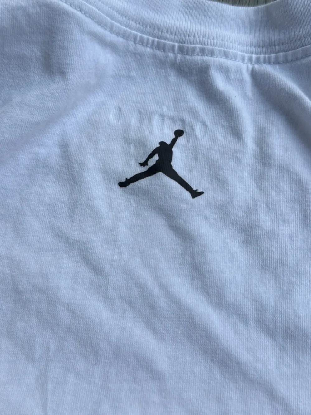 Jordan White Graphic Basketball Tee with Red & Black Accents